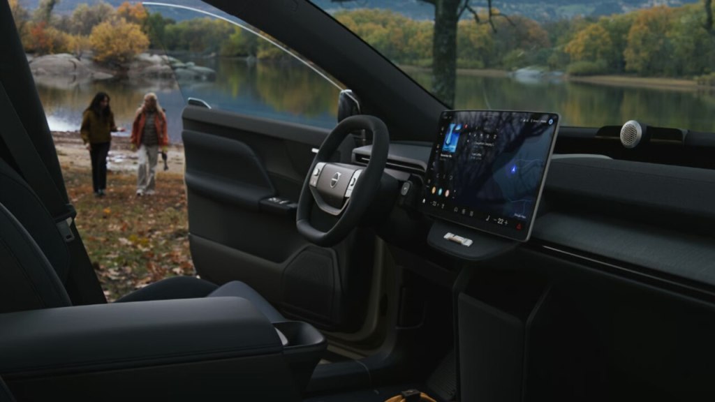 Interior do Volvo EX60 com central multimídia, painel minimalista e sistema Google integrado
